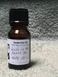 an aromatherapy blend in a bottle labeled "Kick in the Pants for Kate"