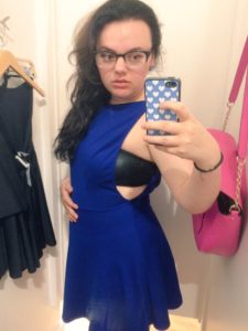 me trying on a blue dress in an AA dressing room