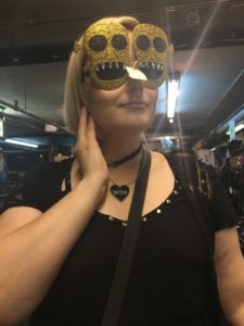 beautiful blonde blogger Mia Moore trying on some skull-shaped sunglasses