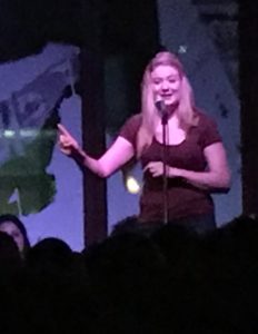 my beautiful blonde friend Georgia animatedly telling a story in front of a crowd