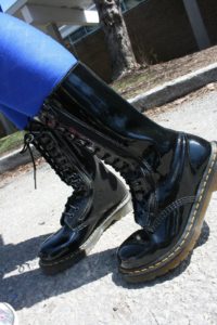 me modeling some black patent leather Dr. Martens boots